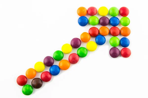 Growing trend concept made of multicolored candies — Stock Photo, Image