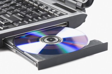 Laptop ejecting a DVD clipart