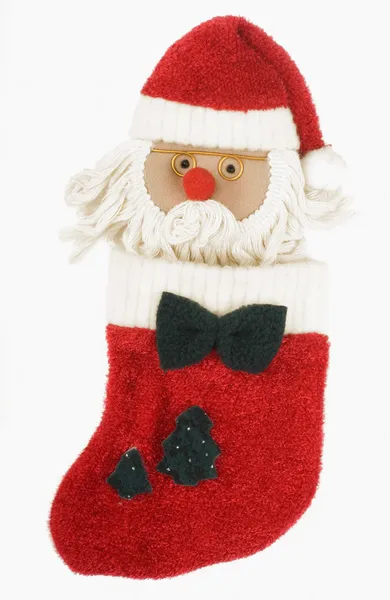 Игрушка Санта-Клауса в рождественском чулке — стоковое фото