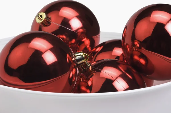 Red baubles in a bowl — Stock Photo, Image