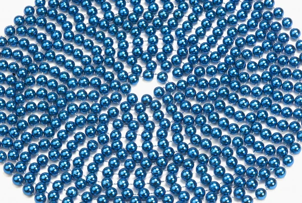 Circular pattern of string of blue beads — Stock Photo, Image