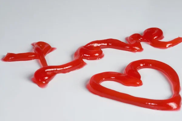 Wort Liebe und Herz aus Marmelade — Stockfoto