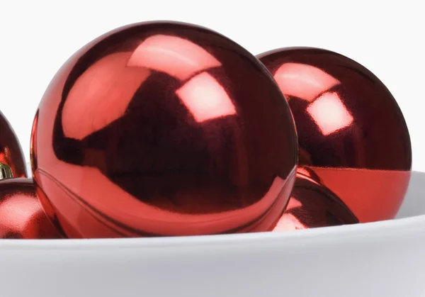 Red baubles in a bowl — Zdjęcie stockowe