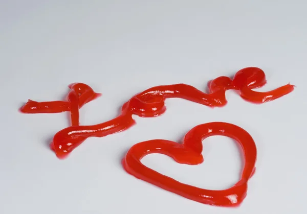 Wort Liebe und Herz aus Marmelade — Stockfoto