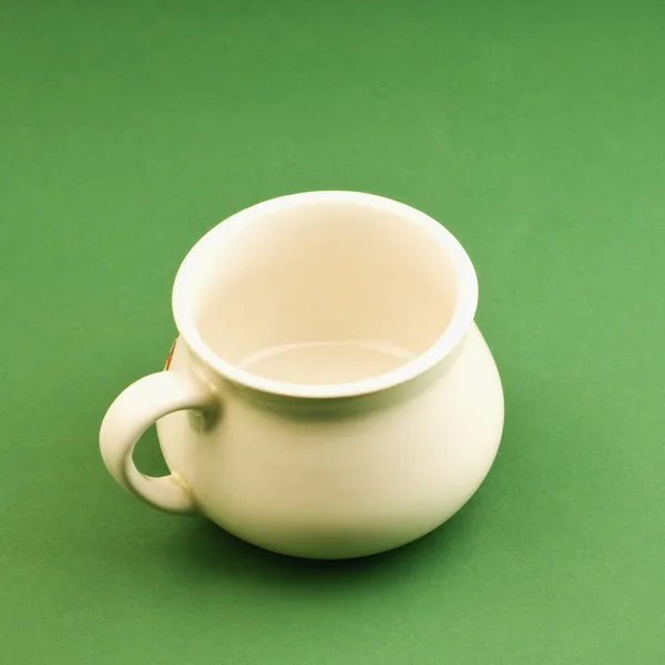 Tea cup on green background — Stock Photo, Image