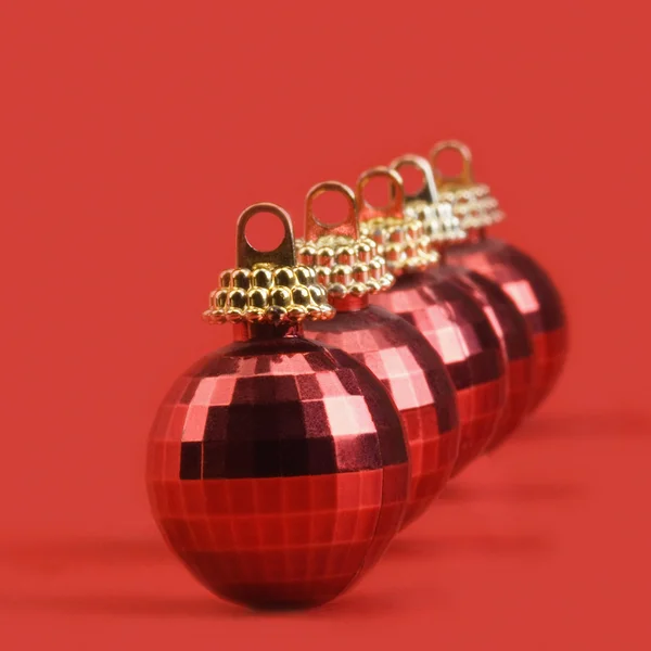 Five red baubles in a row — Stock Photo, Image