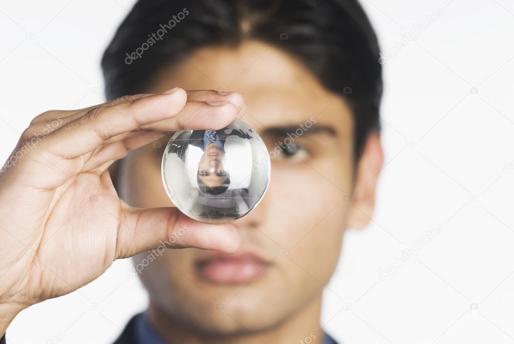 Businessman holding a crystal ball