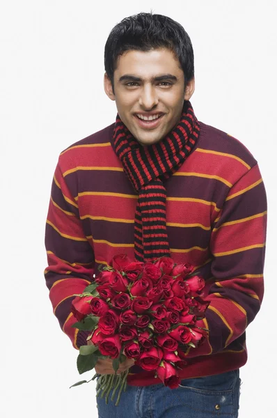 Man holding a bouquet of flowers — Stock Photo, Image