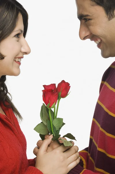 Couple with flowers — Stock Photo, Image