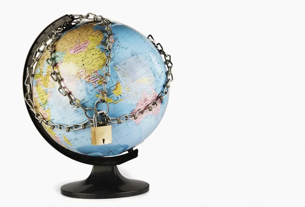 Globe with chains around it — Stock Photo, Image