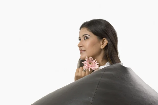 Woman holding a flower — Stock Photo, Image