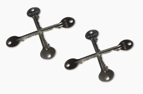 Cross shapes made from keys — Stock Photo, Image