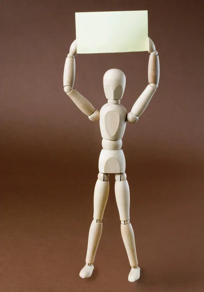 Umělcova figurku držící cedulky — Stock fotografie