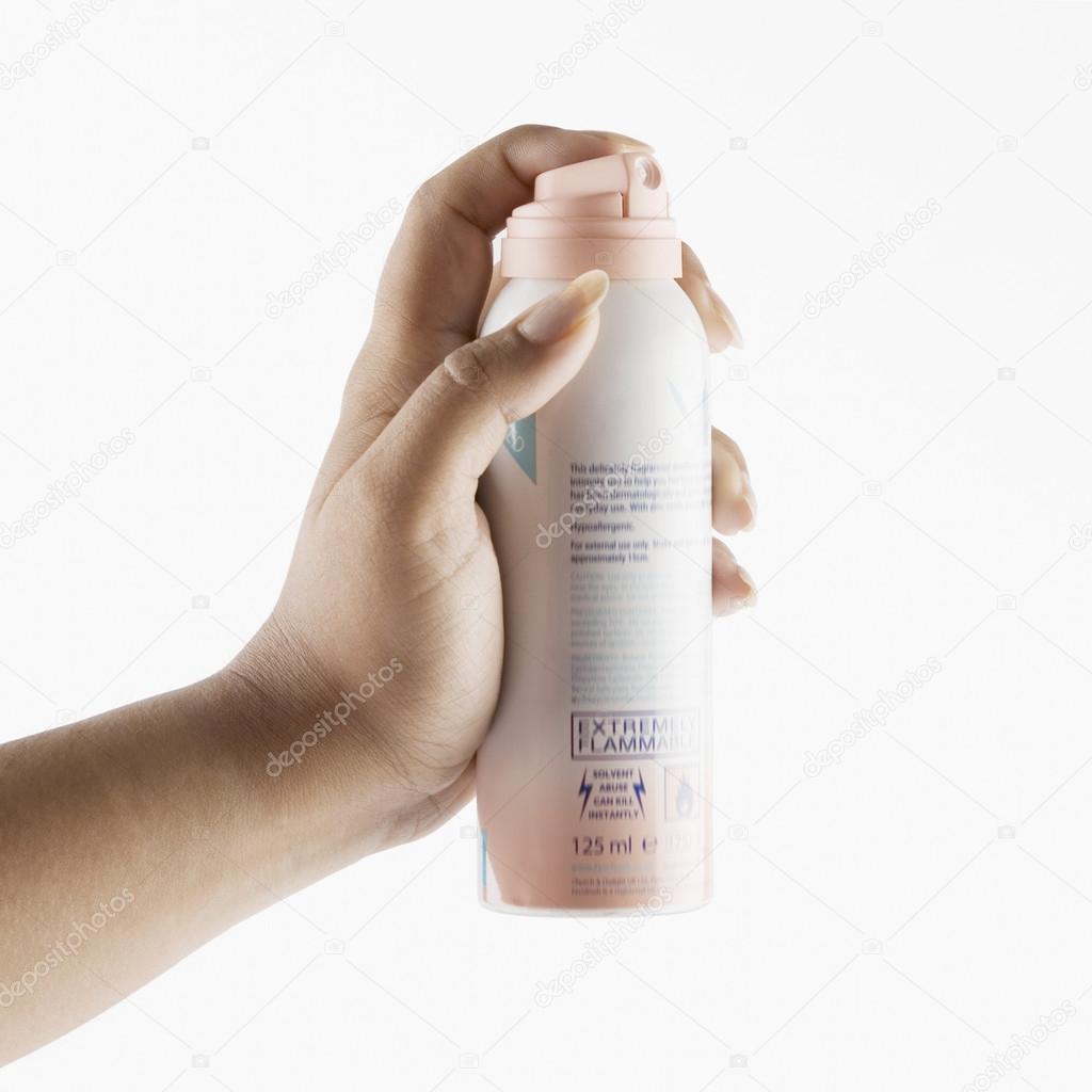 Woman's hand holding a deodorant — Stock Photo © imagedb_seller 32954457