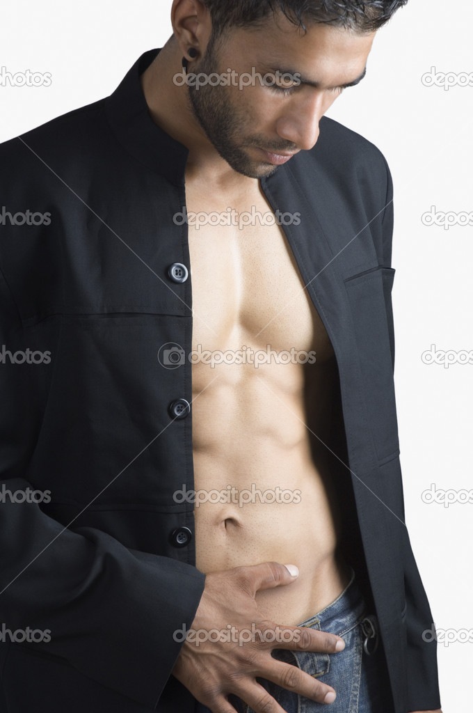 Man checking his abdominal muscles