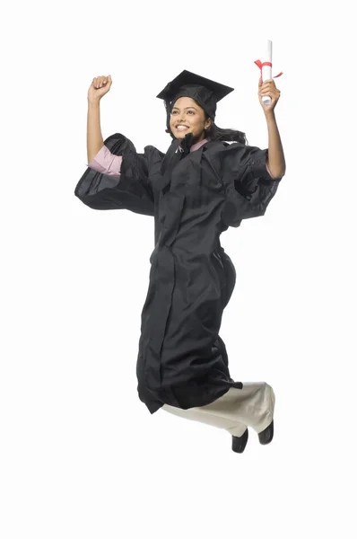 Female graduate cheering with her diploma — Stock Photo, Image