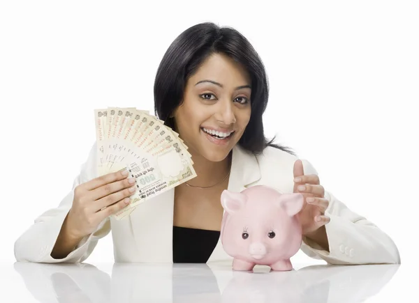 Businesswoman and piggy bank — Stock Photo, Image