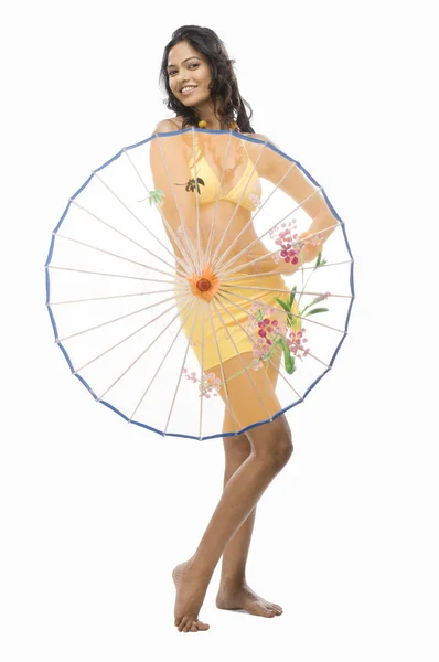 Female fashion model holding a parasol — Stock Photo, Image