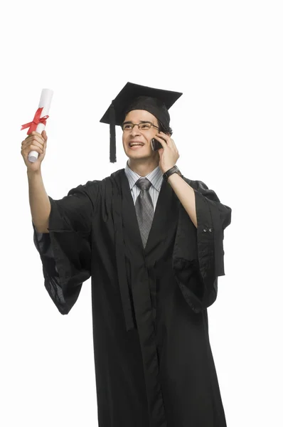 Graduate holding his diploma — Stock Photo, Image