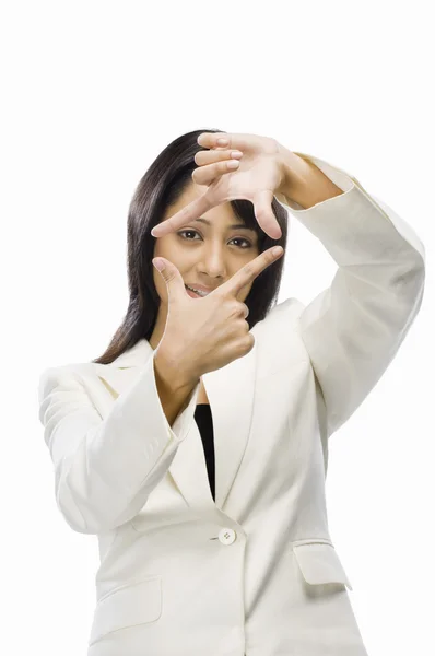 Businesswoman making finger frame — Stock Photo, Image