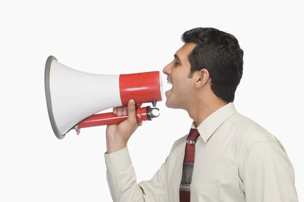 Empresário anunciando em um megafone — Fotografia de Stock