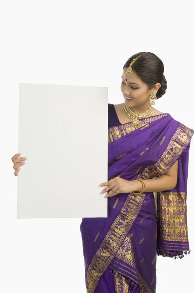 Woman holding a blank placard — Stock Photo, Image