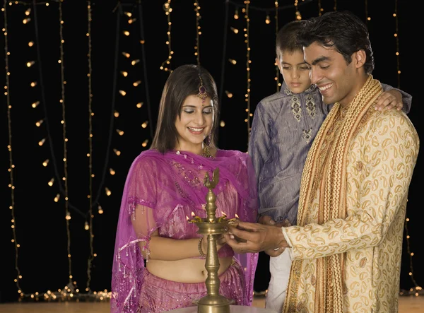 Family lighting oil lamp on Diwali festival — Stock Photo, Image