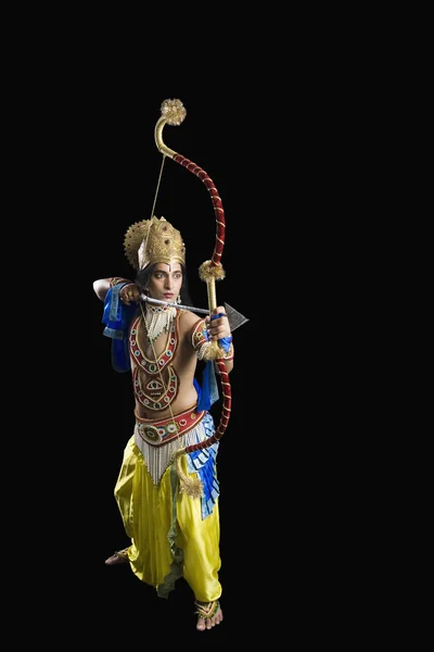Artist holding a bow and arrow — Stock Photo, Image