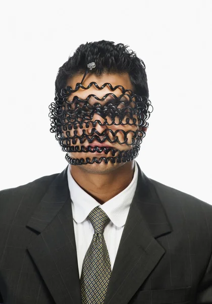 Businessman's face wrapped with telephone cord — Stock Photo, Image