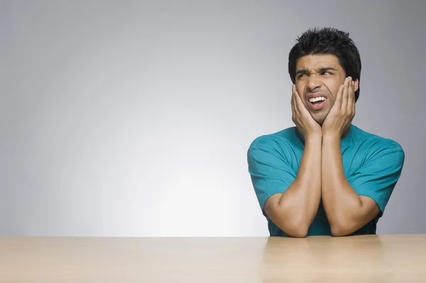 Man leaning on elbows — Stock Photo, Image