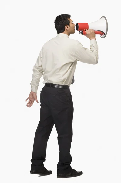 Businessman announcing into a megaphone — Stock Photo, Image