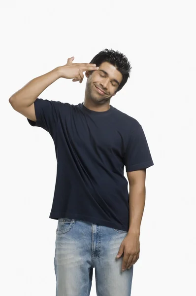 Man making gun sign — Stock Photo, Image