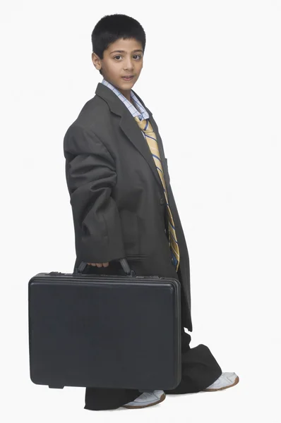 Boy wearing oversized suit Stock Photo