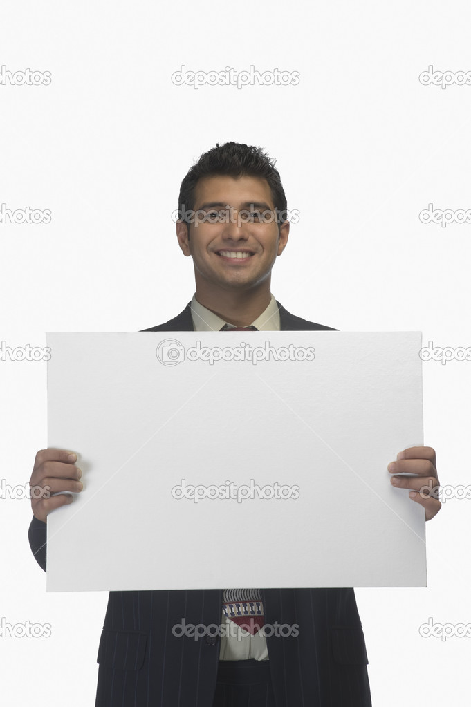 Businessman holding a blank placard