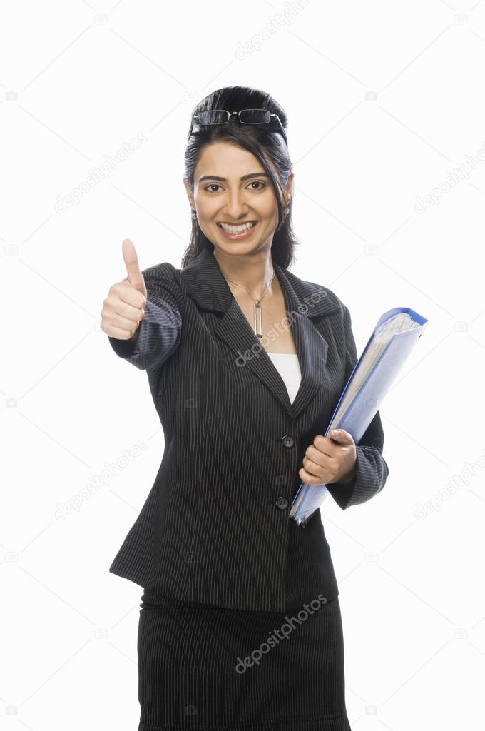 Businesswoman showing thumbs up sign
