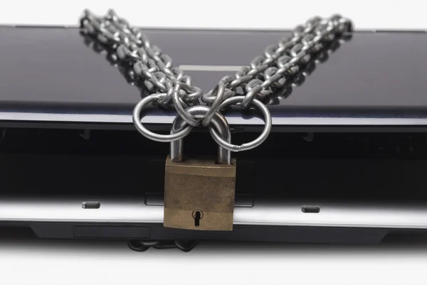 Laptop tied with chain and a padlock — Stock Photo, Image