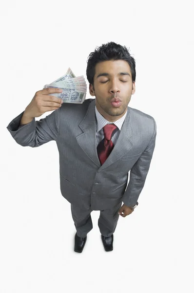 Om de afaceri care deține bani — Fotografie, imagine de stoc