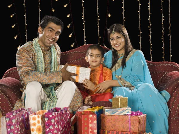 Couple giving gifts to their son on Diwali festival — Stock Photo, Image