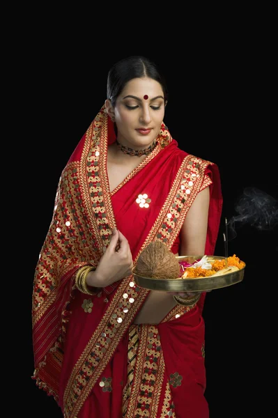 Woman holding religious offering — Stock Photo, Image