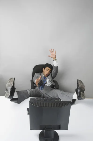 Businessman with his feet up — Stock Photo, Image