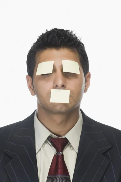 Adhesive notes on the eyes and mouth — Stock Photo, Image