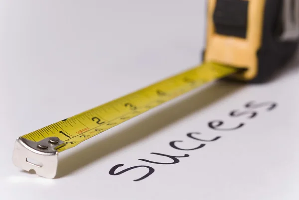 Measuring tape measuring text success — Stock Photo, Image