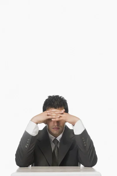 Businessman holding his forehead — Stock Photo, Image