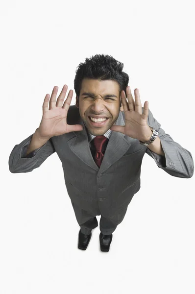 Businessman making a funny face — Stock Photo, Image