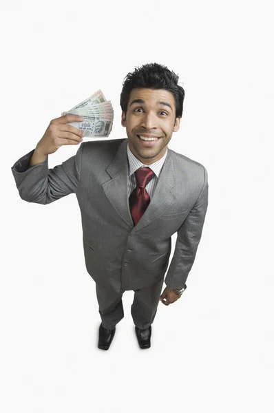 Zakenman bedrijf geld — Stockfoto