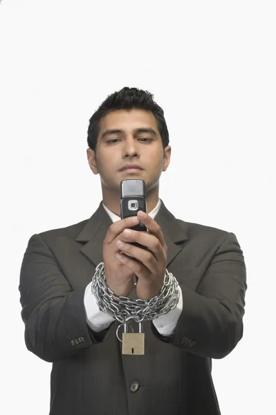 Businessman with his hands in chains — Stock Photo, Image