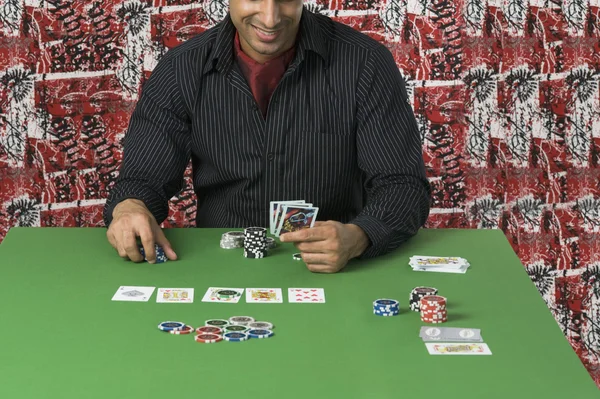 Man at a casino table — Stock Photo, Image