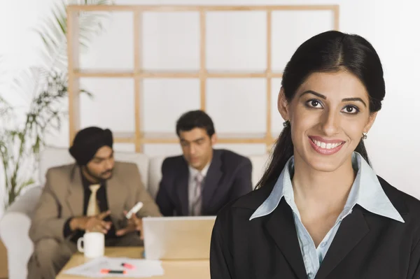 Businesswoman with her colleagues — Stock Photo, Image