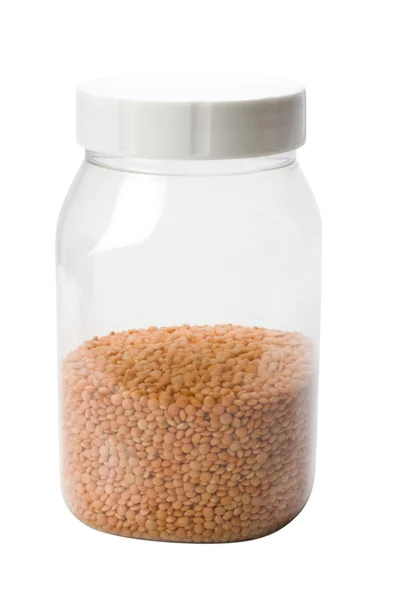 Close-up of red lentil in a plastic jar — Stock Photo, Image