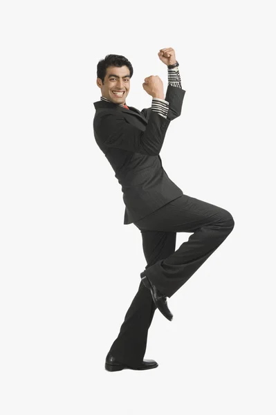 Uomo d'affari con le braccia alzate — Foto Stock
